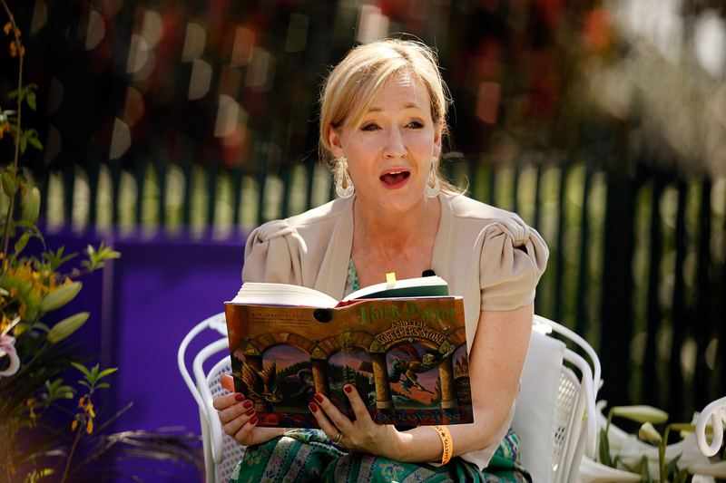 J.K. Rowling reads the book. (Chip Somodevilla/Getty Images)